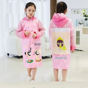 childrens raincoat with a school bag, students outdoor walking safety and transparent poncho