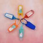 Factory custom logo  30ml custom oem novelty pocket portable silicone perfume hand sanitizer keychain bottle cover case holder