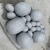 Import New garden Oval pebble shape polished grey granite landscaping stone from China