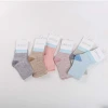 New soft cotton anti-slip elastic baby socks and low price long socks cartoon for baby girls