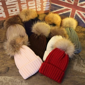 Wholesale fashion thick knitted beanie hats faux fur ball hats custom logo