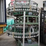 Four shuttle circular loom in weaving machine