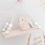 Hot sale solid wood board wood beads design wall hanging floating swing storage shelf