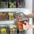 Import Refrigerator Organizer Bins with Lids Clear Plastic Large Fridge Organizer Stackable Fridge Food Organizer with Handle from China