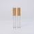 Import 2.5ml clear round bottle cosmetic packaging with applicator lip gloss tubes with bamboo top from China