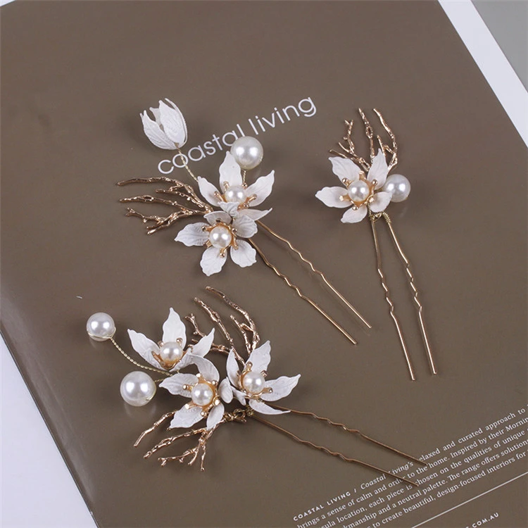 Bride&#x27;s hair is decorated with delicate flowers pearl hairpin set, wedding yarn and ornaments, dress hair fork