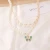 Import Gold plated pearl layered pave butterfly pendant half pearl half paper clip chain necklace for women from China