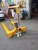 Import Hand Operated Paper Roll Pallet Truck Paper Cart Hand Pallet Trolley Forklift Manual Hydraulic Pallet Truck from China