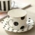 Import simple black dot design new bone china ceramic coffee cup and saucer,gold decal printing ceramic cup with saucer from China