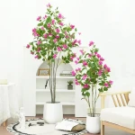 Artificial plant near natural flower potted for home party wedding decoration