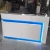 Import Customized Size Fast Delivery Beauty Salon LED Light Reception Desk from China