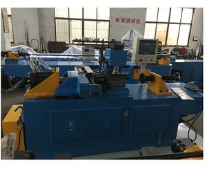 Double-head tube end forming reducing machine