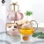 Import elegant decal antique bone china white ceramic gold porcelain pakistan tea tasting set tea coffee cup set with glass teapot set from China