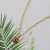 Import Fashion Lady Party 14k Golden Red Charm Round Horus Eye Necklace Pendant Stainless Steel from China