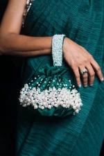 Check out our stunning collection of wedding potli bags, evening bags, and beaded purses!