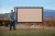 Import 84 inch foldable outdoor projection screen with round stand legs from China
