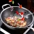 Import SSGP Kitchen Fry 3 Ply Stainless Steel Frying Pans Round Bottom Wok Honeycomb Pan With Lid from China