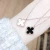 Import wholesale hypoallergenic classic design rose gold plated black white double sided Four-leaf clover pendant dainty necklace from China