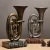 Import Antique Statue Saxophone Guitar Trumpet Sculpture Musical Instruments Orchestra Finishings Resin Sculpture Figurine Craft from China