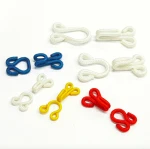 Fabric covered metal dress hook and eye closure for garment accessory