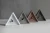 Import Home decorative unique triangle concrete mechanical table clock from China