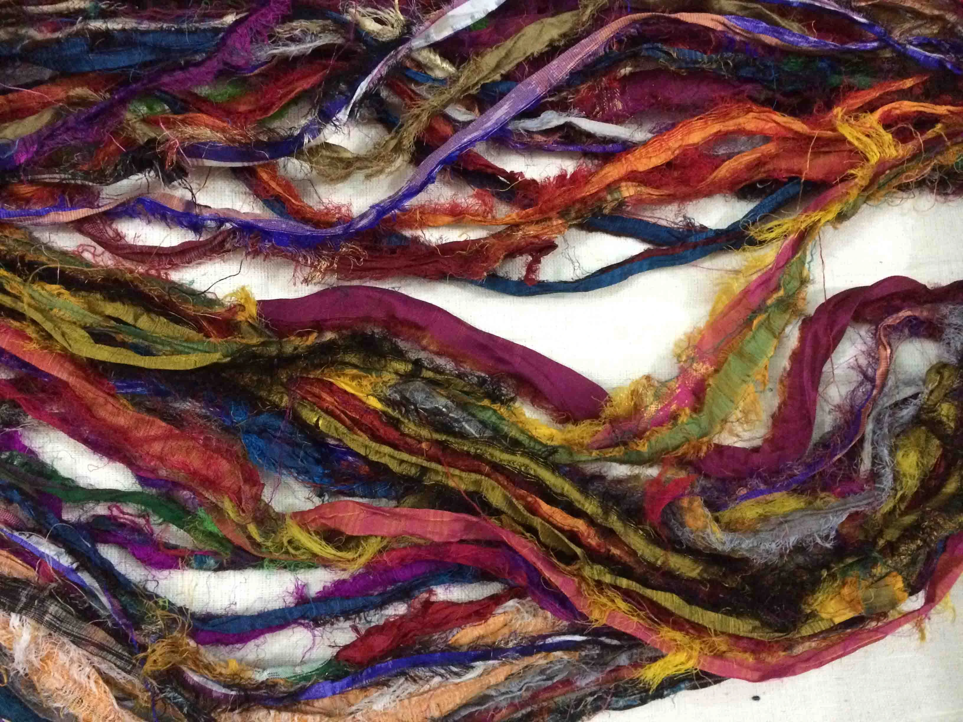 multii colored sari silk ribbon yarns made from recycled sari silk fabric suitable for yarn and fiber stores