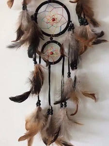 Pheasant feather dream catcher with four circles