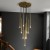 Import simple gold color hanging light dining room stair chandelier aluminum long tube pendant lamp from China