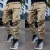Import 2021 New trendy muscle fitness mens clothing spring autumn sports casual cargo sweatpants reflective striped track pants from China