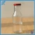 Import 300 ml 12 oz empty soy milk packing juice glass bottles with metal lid from China