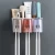 Import Bathroom Storage Box Rack Wall Mount Automatic Toothpaste Dispenser Toothbrush Holder from China