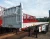 Import CIMC HUAJUN 3-axles semi truck trailer sale heavy duty 30 ton 40ft container transport flatbed semi trailer from China