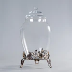glass drink dispenser with tap and elegant metal base