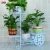 Import Living room corner steel flower pot black metal plant stand with two rear wheels from China