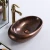 Import New arrived red copper color antique oval ceramic sanitaryware countertop bathroom vessel sink hand wash art basin from China
