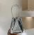 Import Silver patent leather hand-held small bag cowhide design sense female bag bright leather small public female bag street trend from China