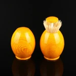 Small automatic toothpick box with yellow wood grain