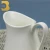 Import wholesale stock manufactures pure white hotel ceramic milk jug from China