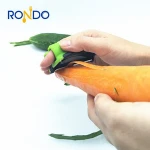 2020 new style stainless steel fruit and vegetable peeler silicone material finger handle