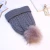 Import 2020 Stylish Custom Thick Blank Chunky Knit Hats Beanie Faux Fur Pompoms Winter Caps from China