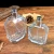 Import 2021 hot Clear 50ml 100ml glass perfume bottle empty glass round perfume bottle with spray from China
