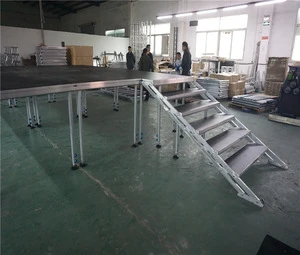 folding portable stage and crowd fencing barrier for stage equipment