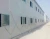 Import Low cost prefabricated sandwich panel house with steel frame from China