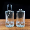 25ml 50ml Cylinder round glass empty perfume bottle black cap cylinder perfume bottle with emboss thick bottom base