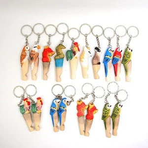 factory outlet hot selling stock wood material handmade carving animal or cartoon shape whistle or keychain for kids gifts