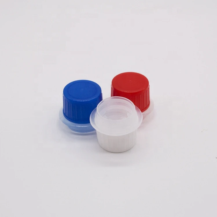 Multi-color plastic closure cap for lubricant spray