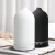Import Newest White Ceramic Electric Essential Humidifier Fragrance Home Ultrasonic Aroma Therapy Essential Oil Diffuser from China