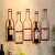 Import wholesale golden wine bottle  holder retail bottle display racks wine racks wall hanging wine stopper display rack from China