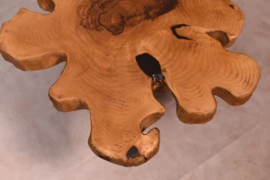 The table is artistically designed in the shape of a flower made of natural wood