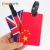 Import 3D embossed brand PVC travel luggage tags soft rubber flag travel luggage tags with belt for gifts from China